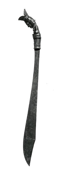 Piso sanalenggam (sword), Toba Batak artist, Water buffalo horn, copper/zinc alloy (sun inlay and end of the handle), lead (necklace and eyes of the handle figure), iron alloy, Toba Batak