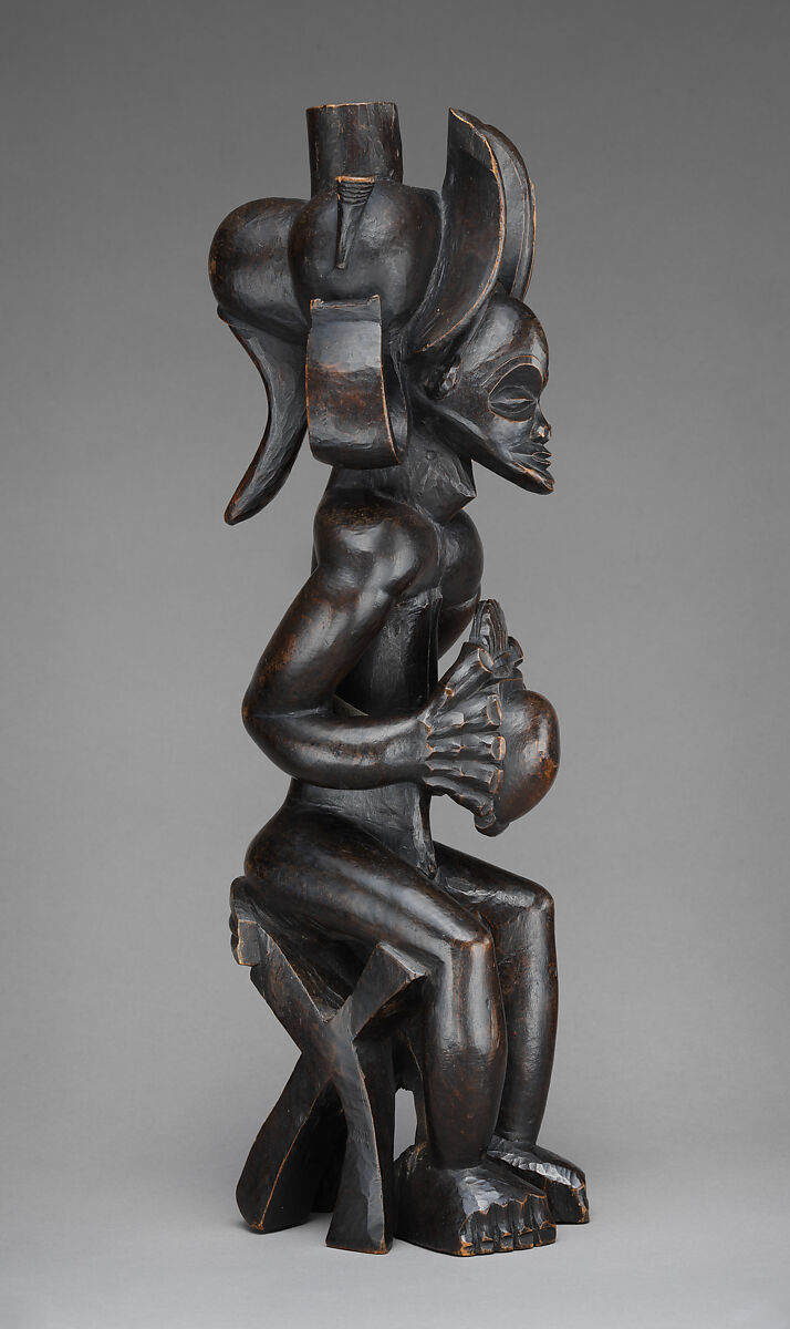 Mwanangana (lord of the land) playing a sanza, Chokwe artist, Wood (uapaca), cloth, plant fiber, beads, dye, resinous coating, Chokwe peoples