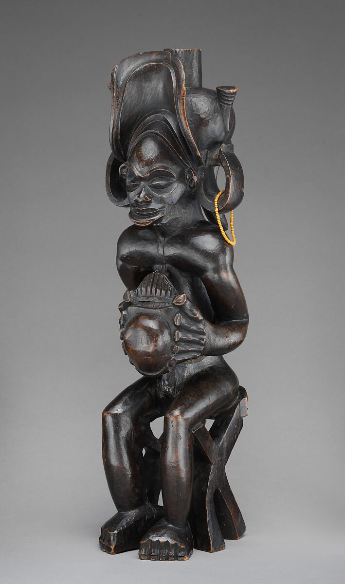 Mwanangana (lord of the land) playing a sanza, Chokwe artist, Wood (uapaca), cloth, plant fiber, beads, dye, resinous coating, Chokwe peoples