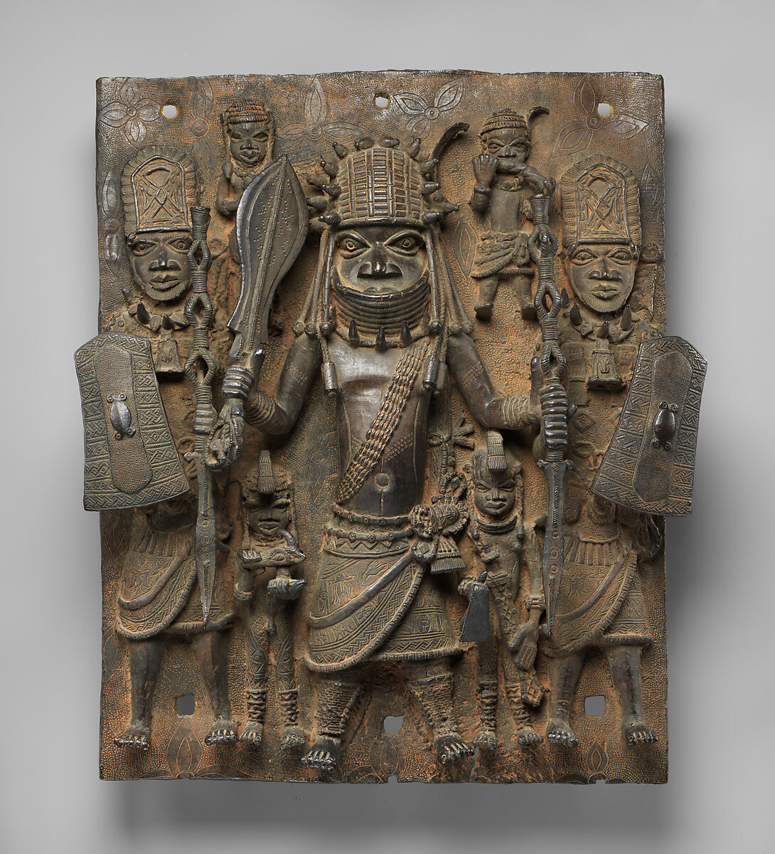 Plaque with Warrior and Attendants, Ìgùn Ẹ́rọ̀nwwọ̀n (brass-casting guild) artists, Brass, Edo peoples