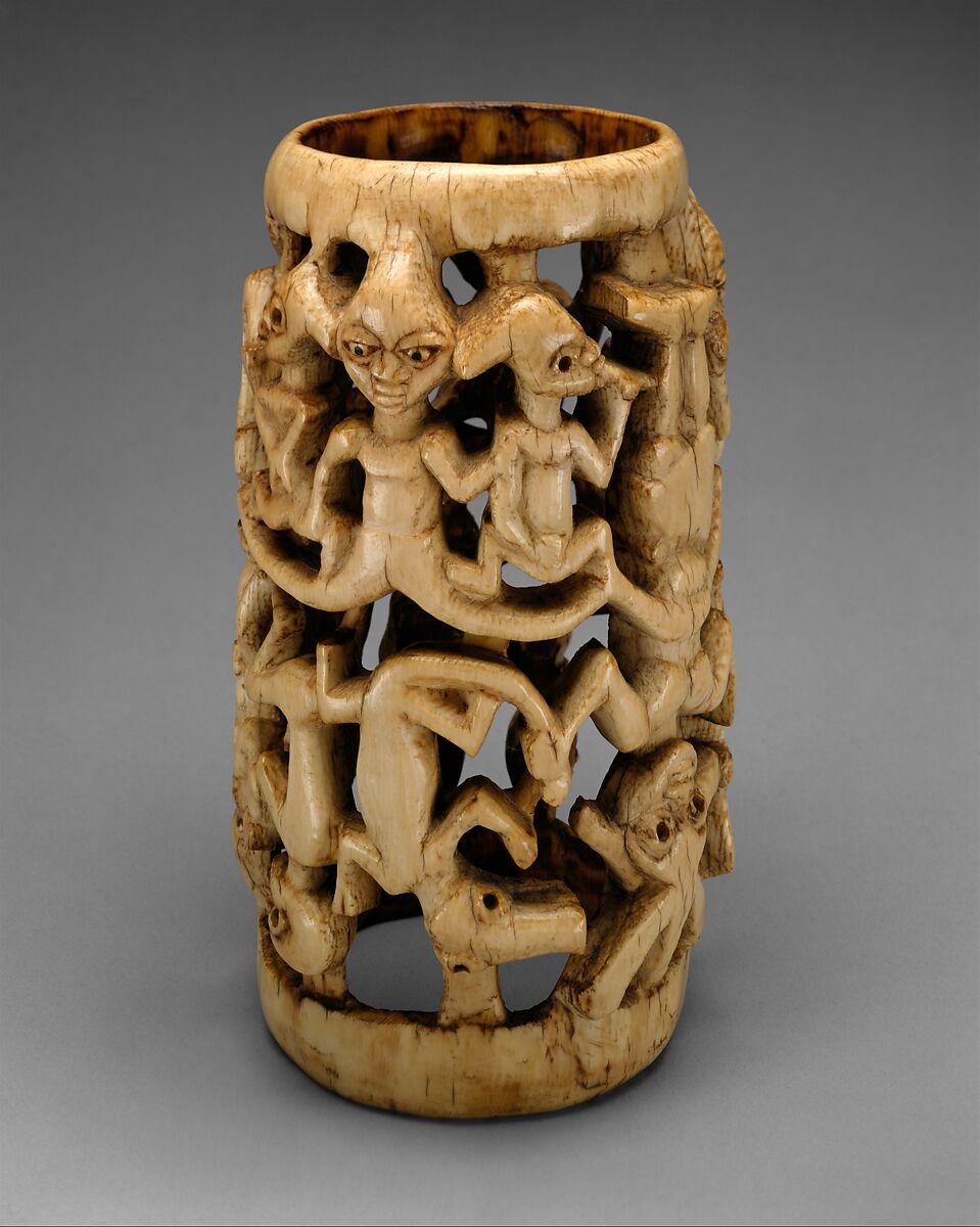 Ivory bracelet, 16th Century - Owo, Nigeria - Yoruba - made from one piece  of ivory, with interlocking figures of a croco…