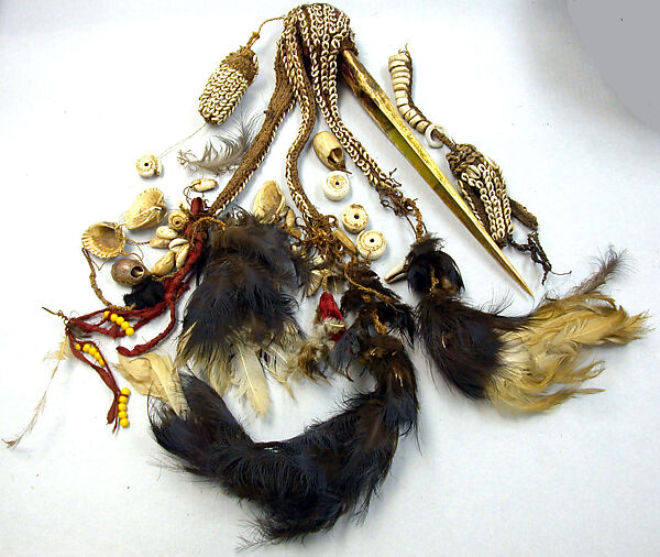 Dagger, Cassowary bone, feathers, shells, tradecloth, feathers, fiber, plastic beads, Mensuat region (?) 