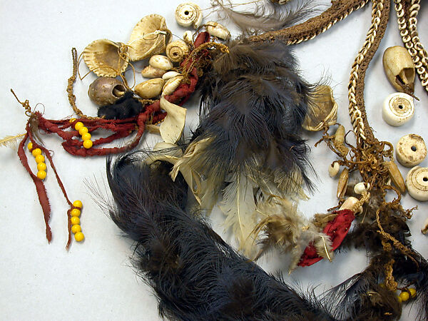 Dagger, Cassowary bone, feathers, shells, tradecloth, feathers, fiber, plastic beads, Mensuat region (?)