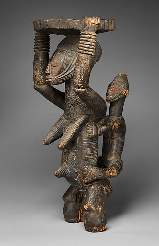 Maternity figure with raised tray