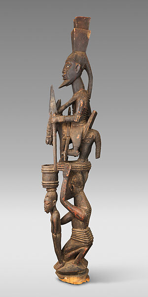 Òpó (veranda post) with equestrian and female figure, Olowe of Ise (Nigerian, born Efon-Alaaye, ca. 1873–1938), Iroko wood, paint, resin, Yoruba peoples