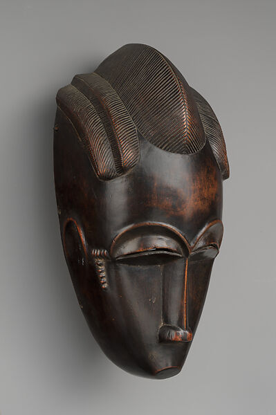 Portrait face mask from Gbagba, a mblo performance, Baule artist, Wood, Baule peoples
