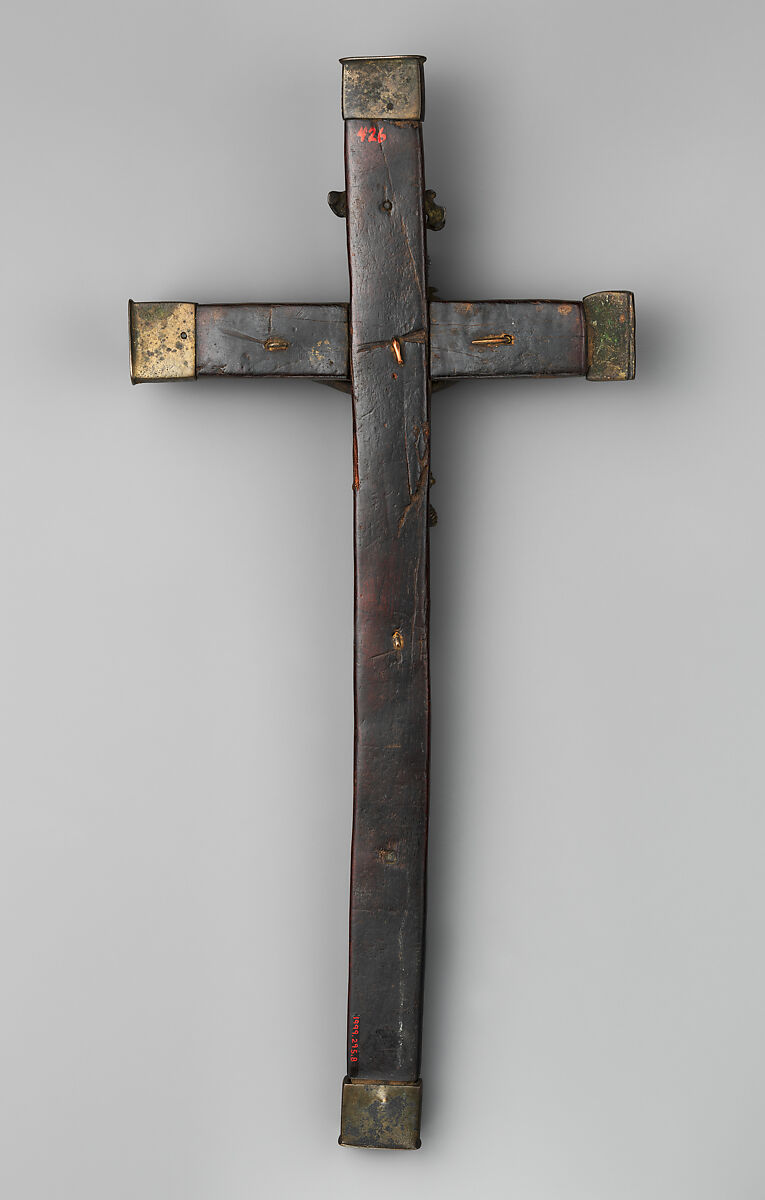 Crucifix, Solid cast brass (Christ), solid cast copper alloy (halo); hollow cast bronze (three end pieces), brass sheet (one end piece), solid cast copper alloy (Mary); forged copper and brass (nails), wood, Kongo peoples; Kongo Kingdom