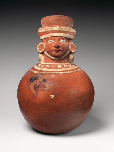 Vessel with face-neck