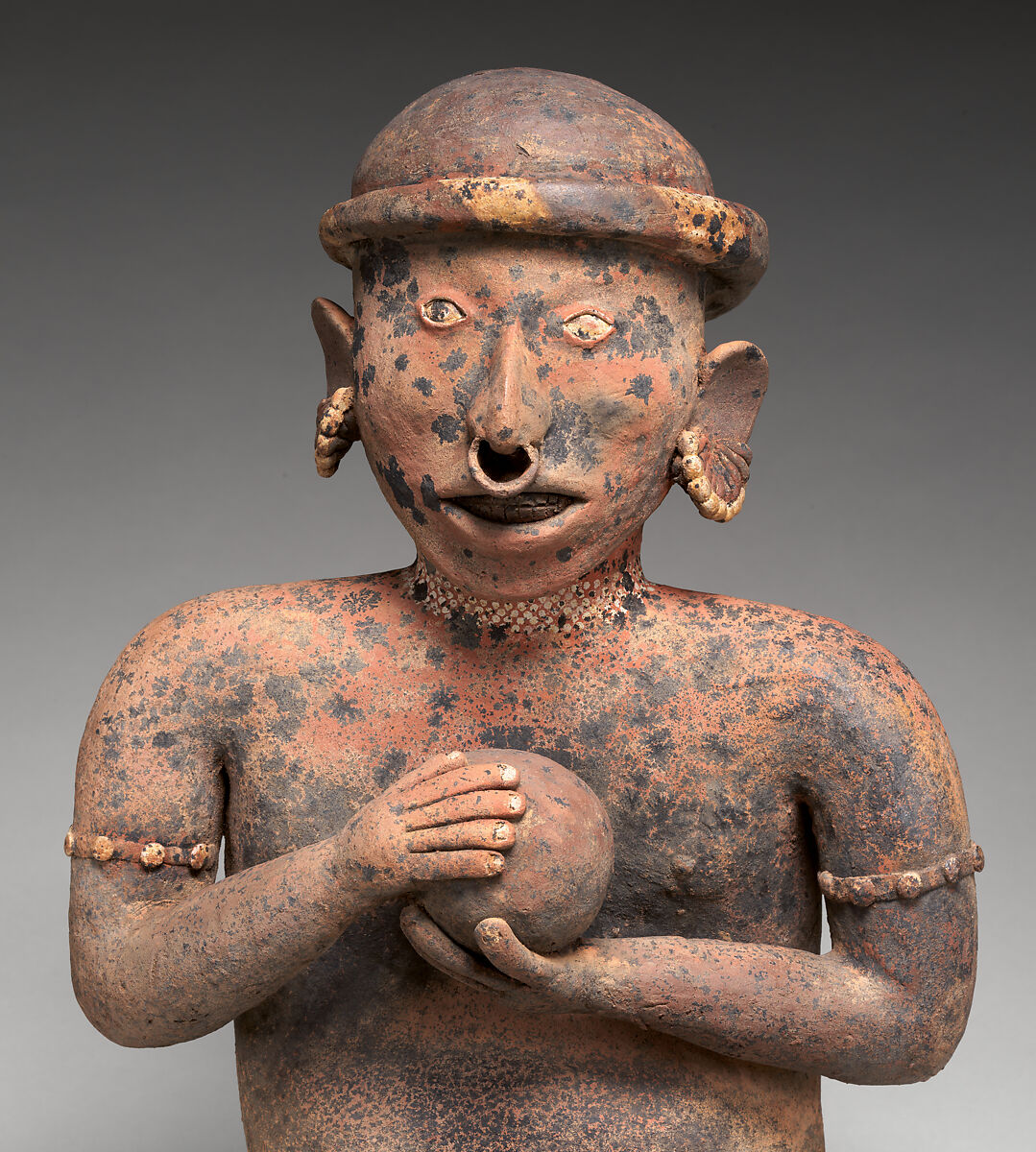 Seated male figure, Nayarit artist(s), Ceramic, slip, Nayarit