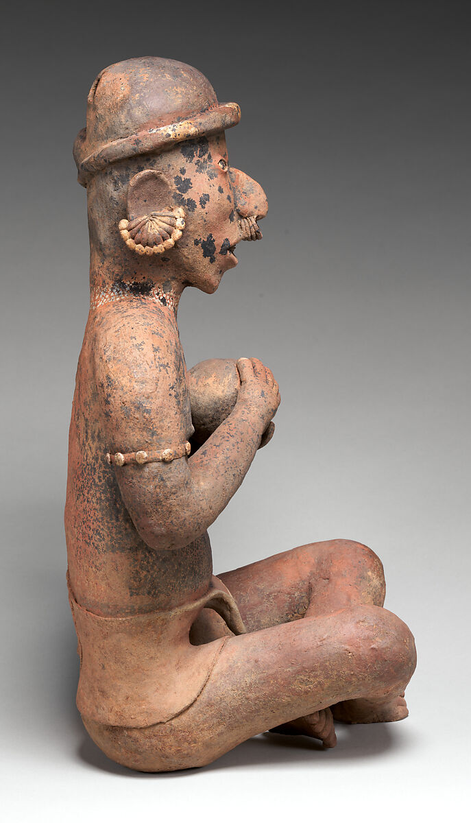 Seated male figure, Nayarit artist(s), Ceramic, slip, Nayarit
