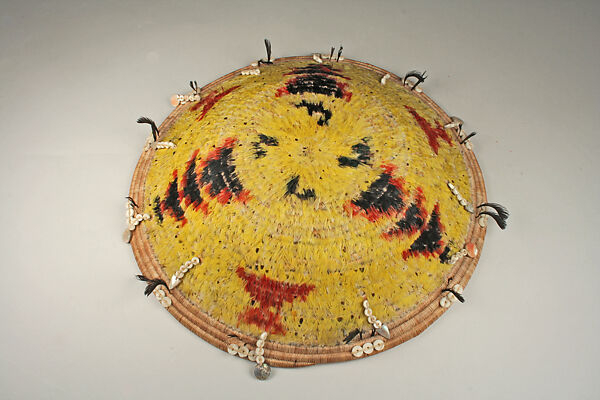 Fully feathered three-rod coiled plate-form basket, Pomo artist (Lake County, California), Willow shoot foundation, sedge root weft, feathers (red-winged blackbird, western meadowlark, mallard, California valley quail topknots), clamshell disk beads, abalone pendants, and cotton string, Pomo (Lake County, California)