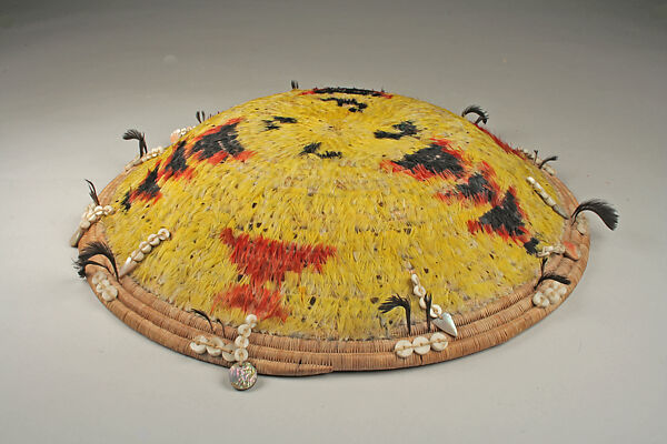 Fully feathered three-rod coiled plate-form basket, Pomo artist (Lake County, California), Willow shoot foundation, sedge root weft, feathers (red-winged blackbird, western meadowlark, mallard, California valley quail topknots), clamshell disk beads, abalone pendants, and cotton string, Pomo (Lake County, California)