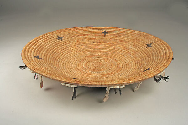Fully feathered three-rod coiled plate-form basket, Pomo artist (Lake County, California), Willow shoot foundation, sedge root weft, feathers (red-winged blackbird, western meadowlark, mallard, California valley quail topknots), clamshell disk beads, abalone pendants, and cotton string, Pomo (Lake County, California)