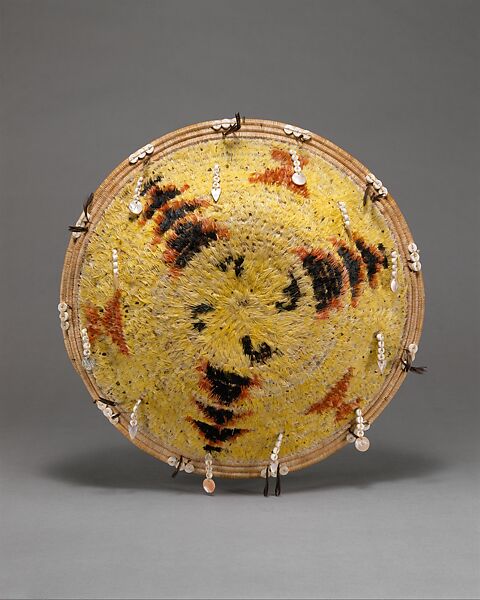 Fully feathered three-rod coiled plate-form basket, Pomo artist (Lake County, California), Willow shoot foundation, sedge root weft, feathers (red-winged blackbird, western meadowlark, mallard, California valley quail topknots), clamshell disk beads, abalone pendants, and cotton string, Pomo (Lake County, California)