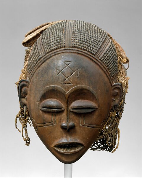 Mask: Female (Pwo), Wood, fiber, brass, pigment, Chokwe peoples 