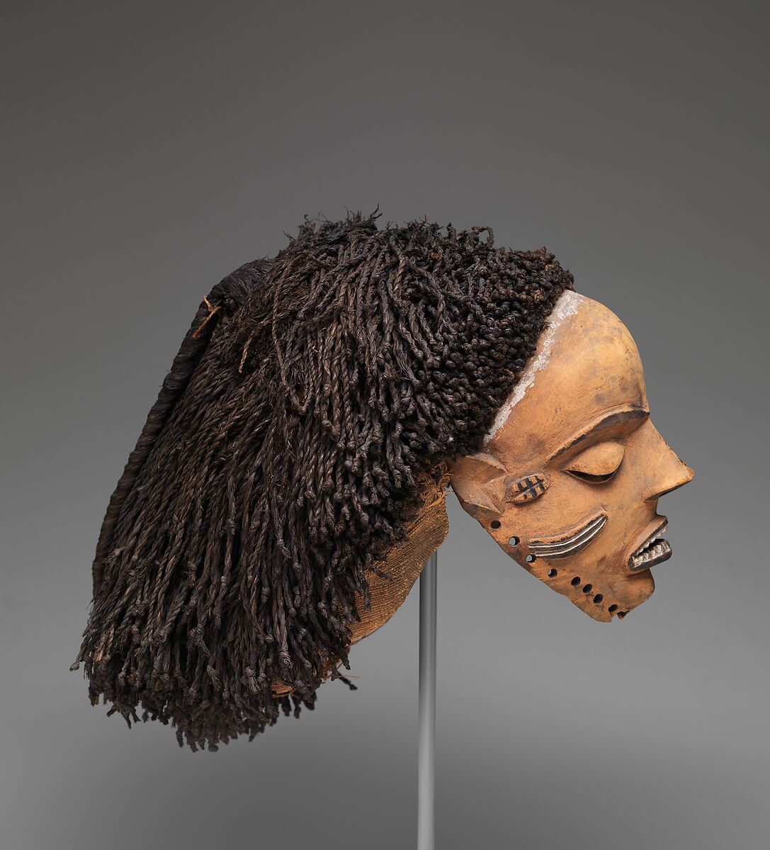 Gambanda (wife of the chief) mask, Pende artist, Wood, plant fiber, pigment, Pende peoples