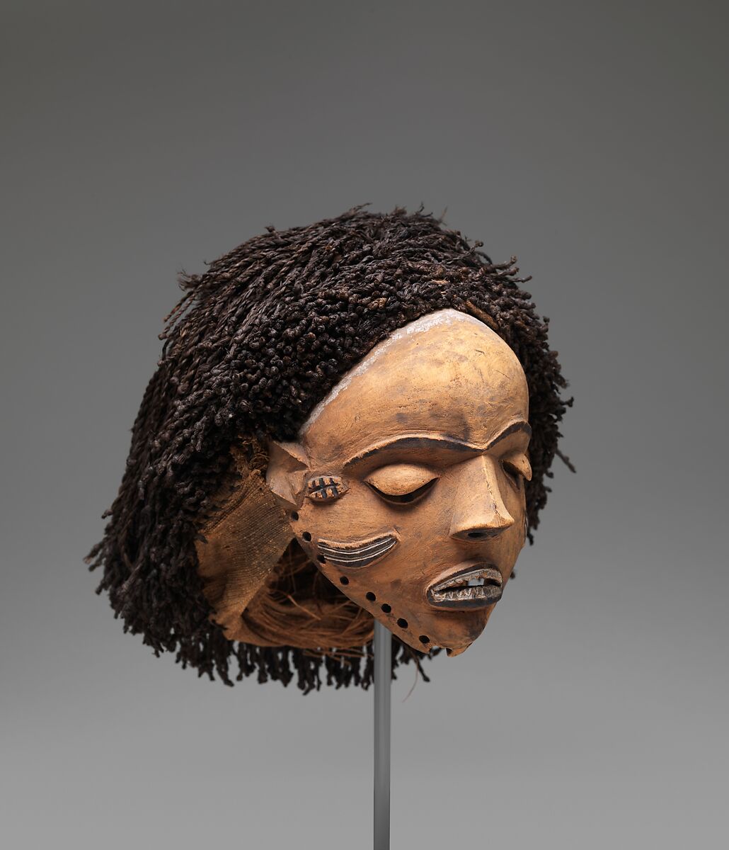 Gambanda (wife of the chief) mask, Pende artist, Wood, plant fiber, pigment, Pende peoples