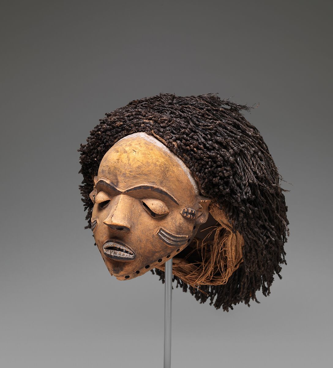 Gambanda (wife of the chief) mask, Pende artist, Wood, plant fiber, pigment, Pende peoples