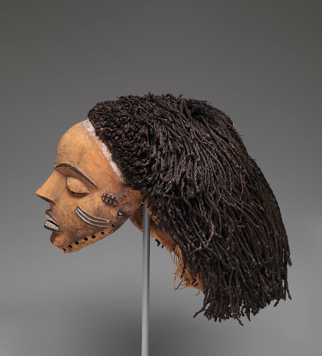 Gambanda (wife of the chief) mask, Pende artist, Wood, plant fiber, pigment, Pende peoples