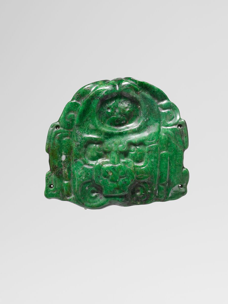 Deity face pendant, Jadeite or omphacite, iron ochre, Maya 