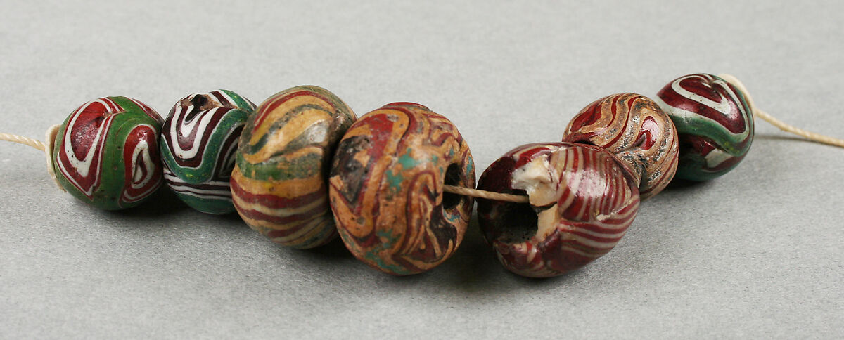 Beads, string of seven, Glass, African, made in Europe 