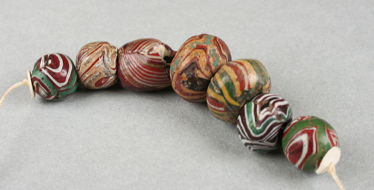 Beads, string of seven, Glass, African, made in Europe