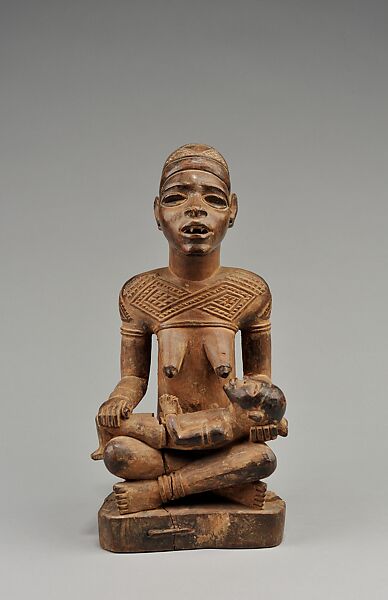 Figure: Seated FemaleSupporting Figure with Clasped Hands (Phemba), Master of Kasadi, Wood (Nauclea latifolia Smith), glass, kaolin, Kongo peoples, Yombe group 