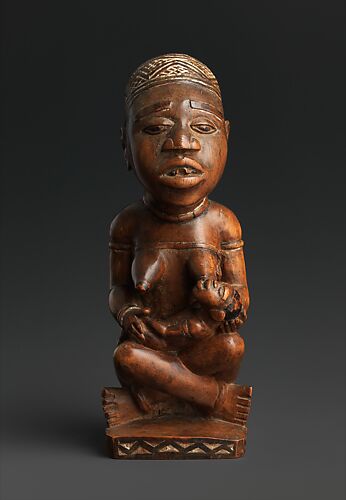 Figure: Seated Female Nursing Child