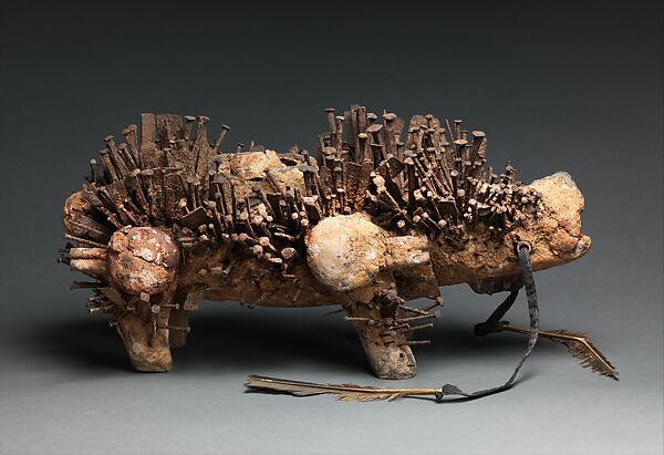 Power Figure (Nkisi N'Kondi: Kozo), Wood, iron, plant fiber, textile, glass, resin, feathers, leopard tooth, leather, pigment, Kongo peoples; Yombe group 