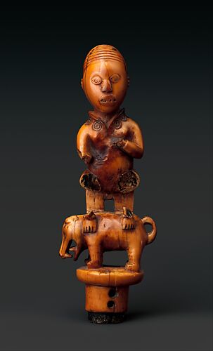 Staff Finial: Chief Seated on Dog