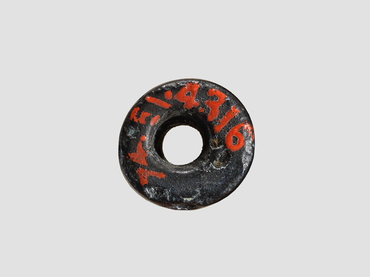 Cylinder seal and modern impression: female figure, ibex, lion, Black-grey hematite, Cypriot