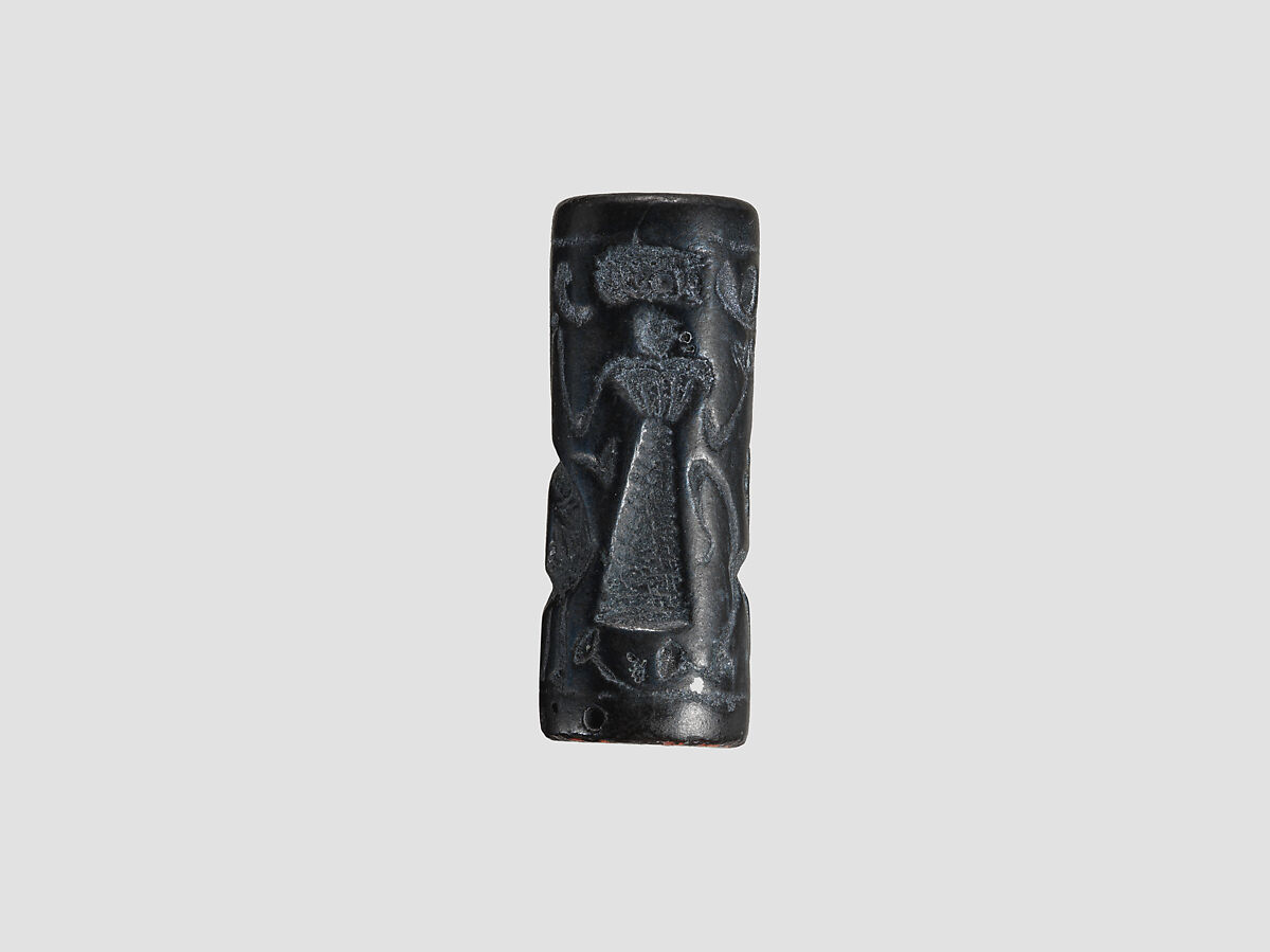 Cylinder seal and modern impression: female figure, ibex, lion, Black-grey hematite, Cypriot