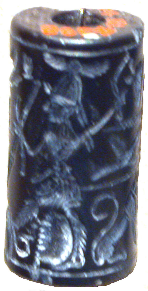 Cylinder seal and modern impression: hunter spearing a lion before deity with staff, Black hematite