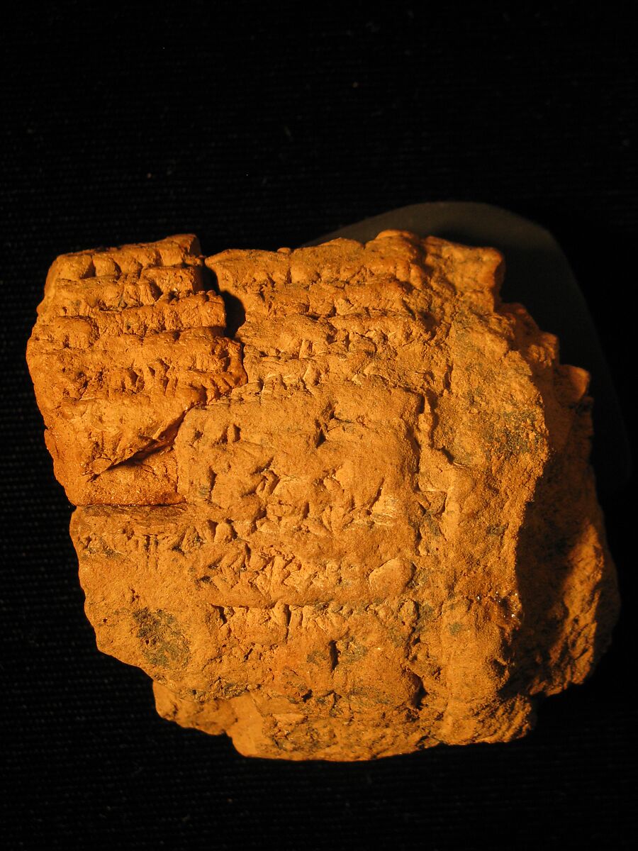 Fragment of a solid clay barrel cylinder inscribed with an unidentified hymn, Clay 