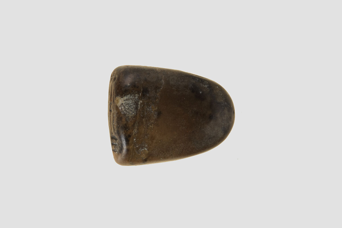 Stamp seal (octagonal pyramid, worn) with cultic scene, Limestone, olive, Assyrian