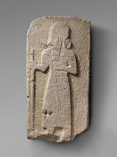 Relief: bearded figure holding staff; hieroglyphic inscription
