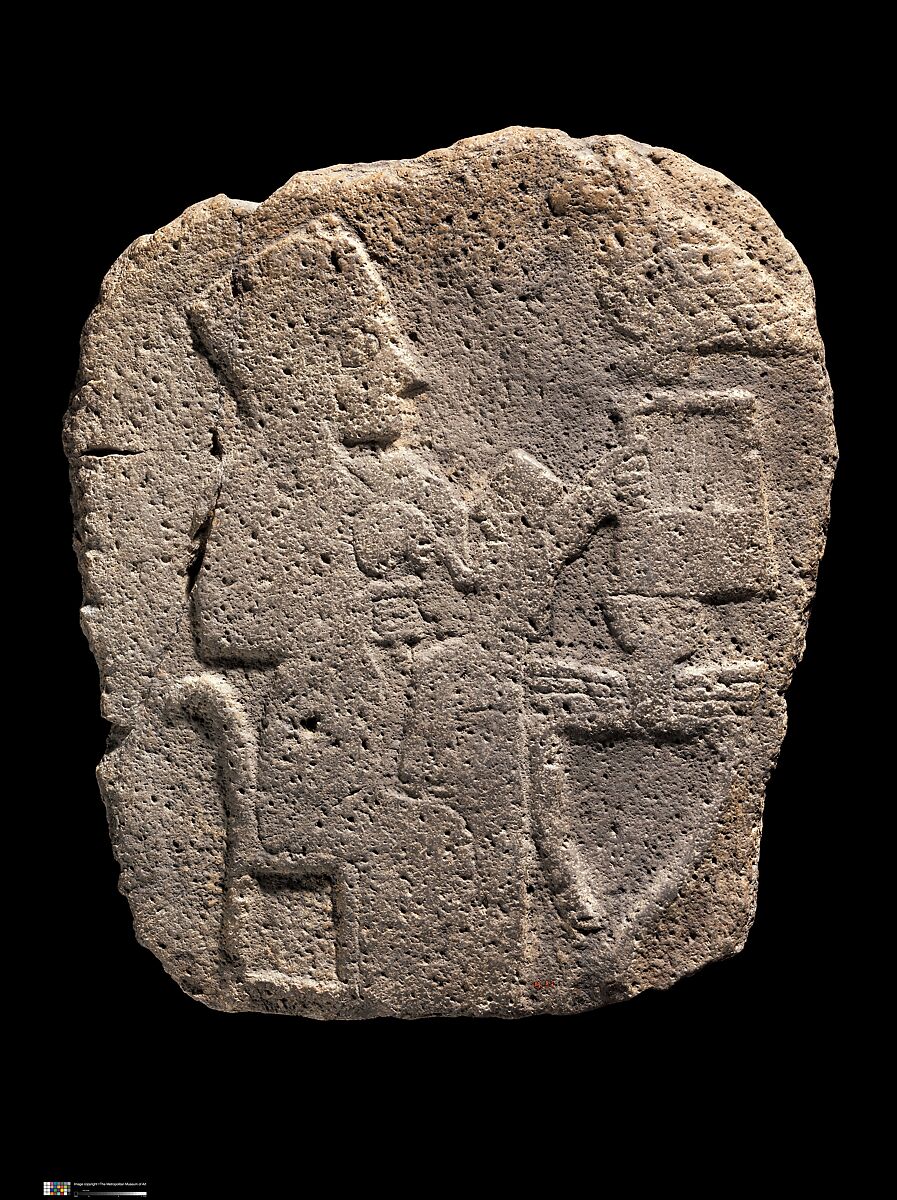 Relief: woman seated at a table, Basalt 