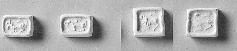Stamp seal (cubical) with animals, Steatite, black, Phoenician (?) 