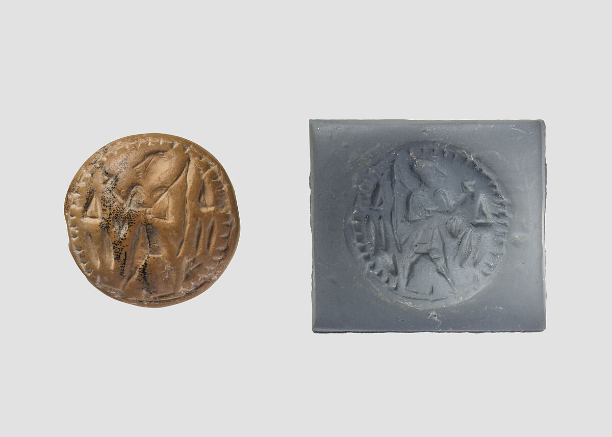 Double convex discoid (bulla) seal engraved on two faces, Yellow-tan limestone, Hittite 