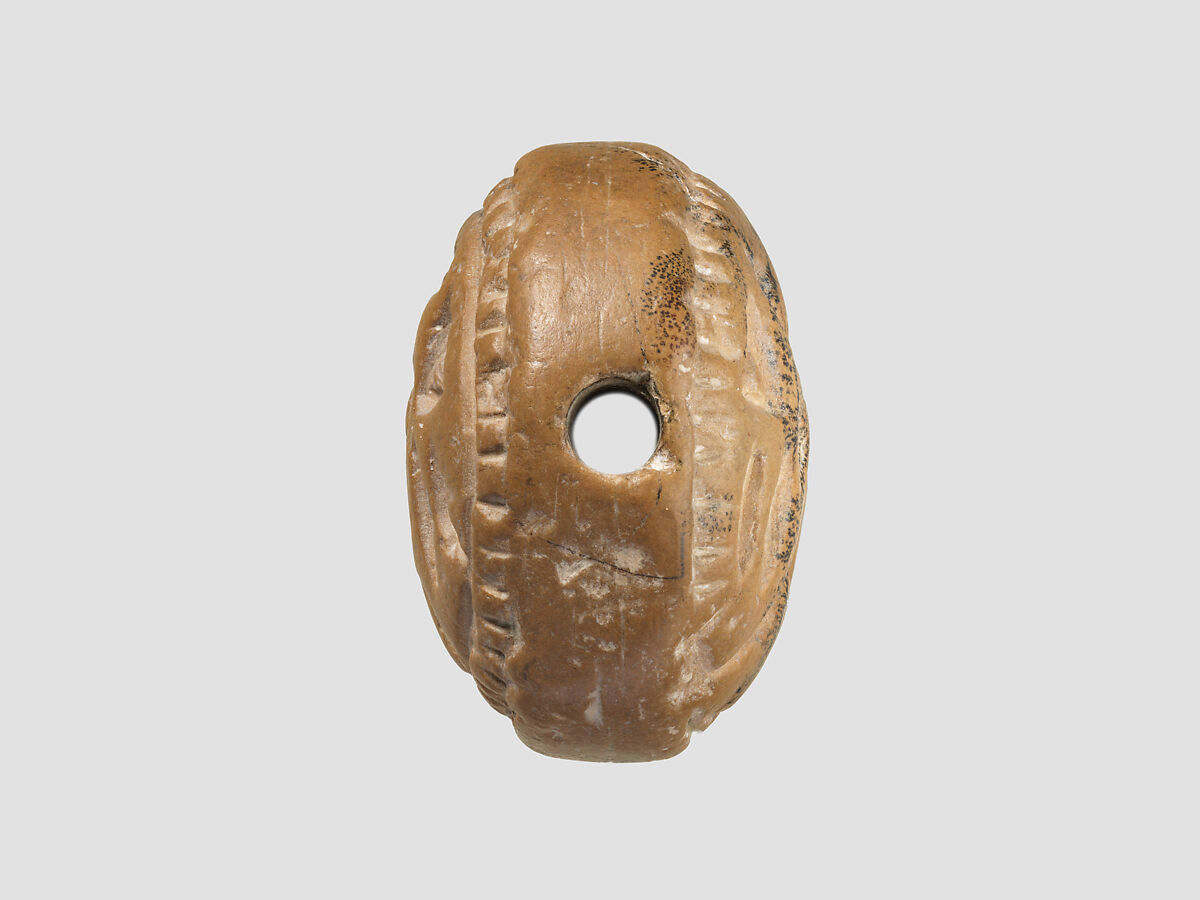 Double convex discoid (bulla) seal engraved on two faces, Yellow-tan limestone, Hittite