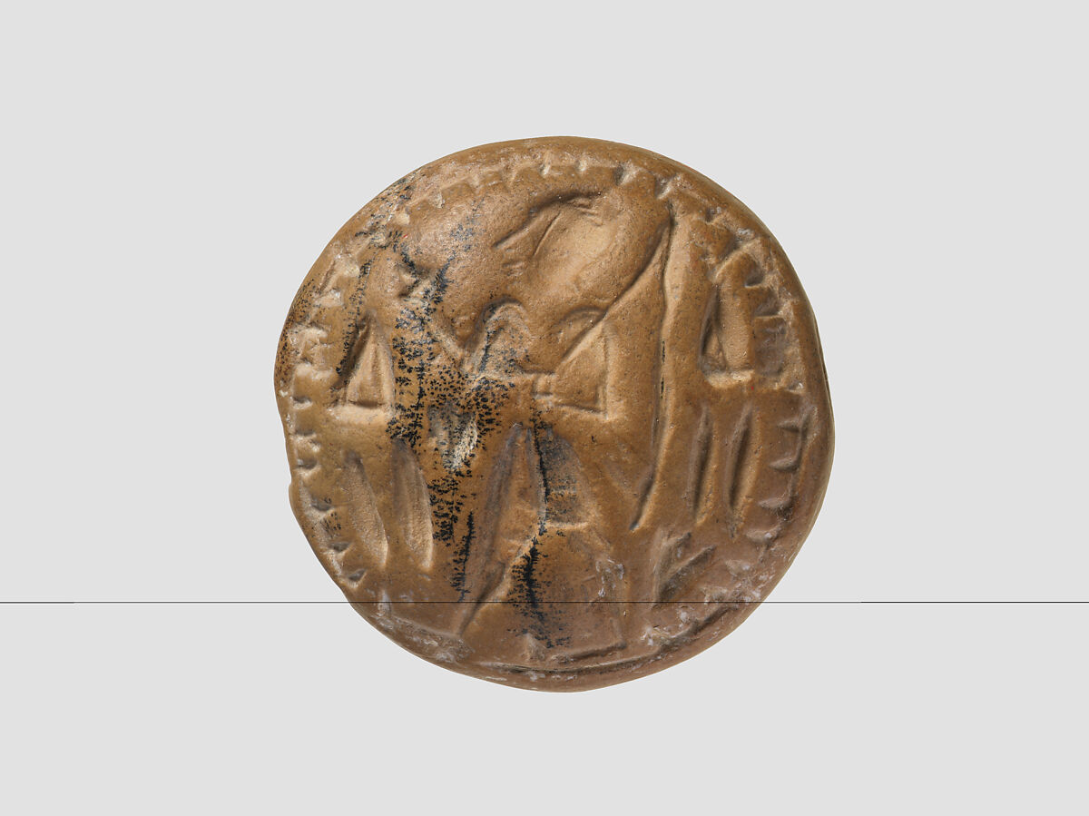 Double convex discoid (bulla) seal engraved on two faces, Yellow-tan limestone, Hittite