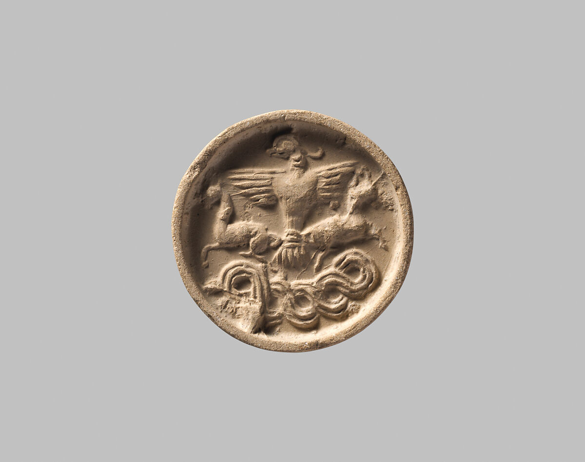 Stamp seal with a knob handle: bird of prey with two horned animals caught in its talons, Black steatite, Old Assyrian Trading Colony