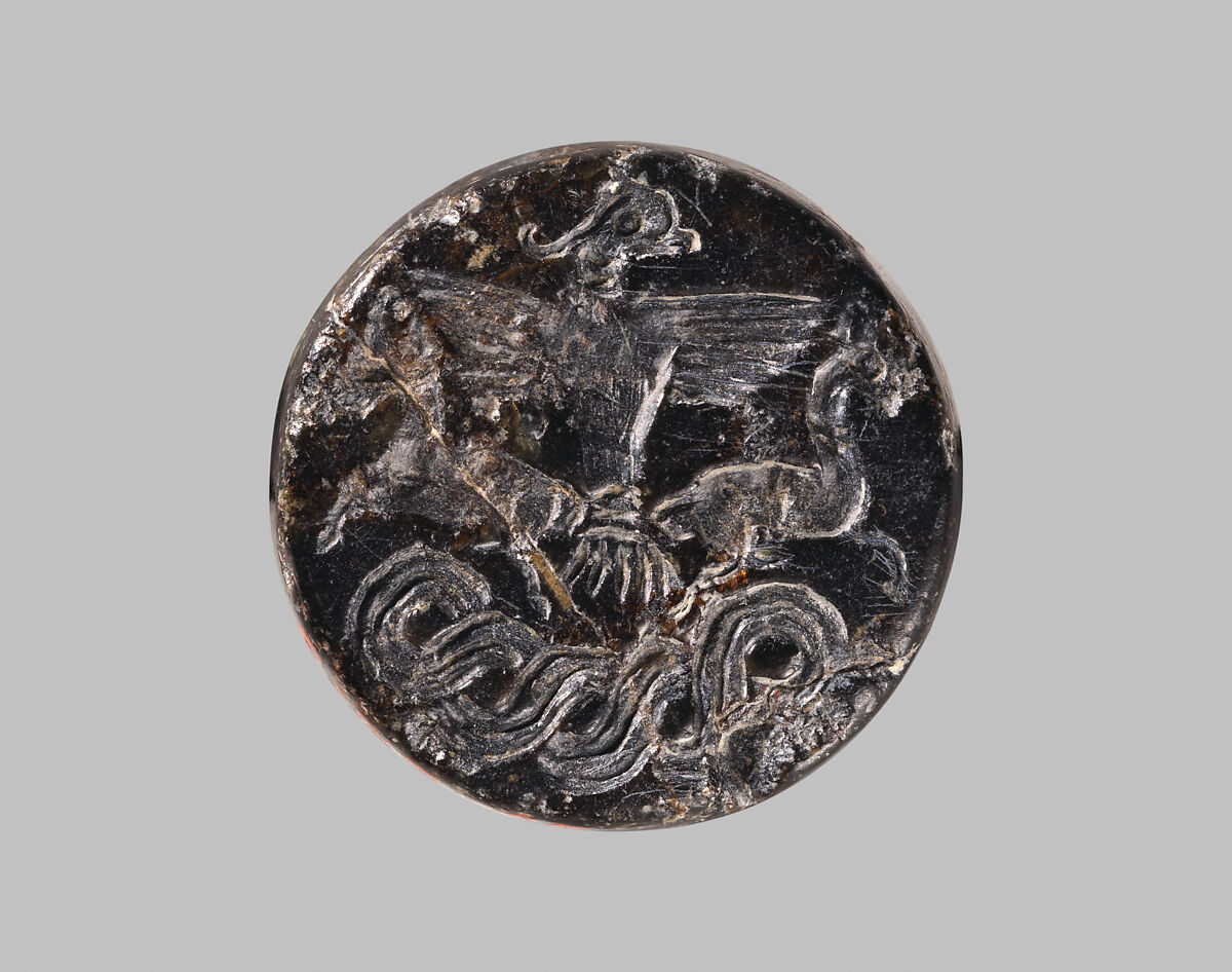 Stamp seal with a knob handle: bird of prey with two horned animals caught in its talons