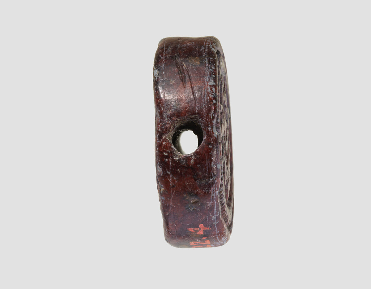 Discoid seal engraved on both faces, Red steatite, Hittite