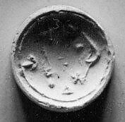 Double convex discoid (bulla) seal engraved on two faces, Yellow steatite, Hittite 