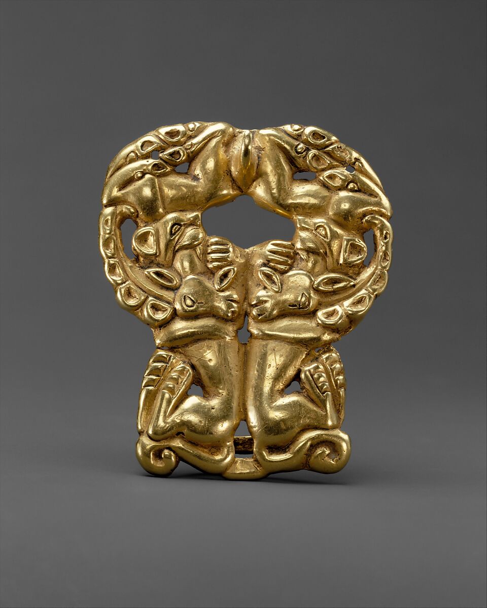 Belt buckle with paired felines attacking ibexes