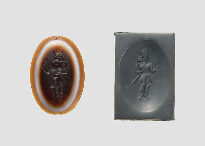 Stamp seal: standing noble holding a flower