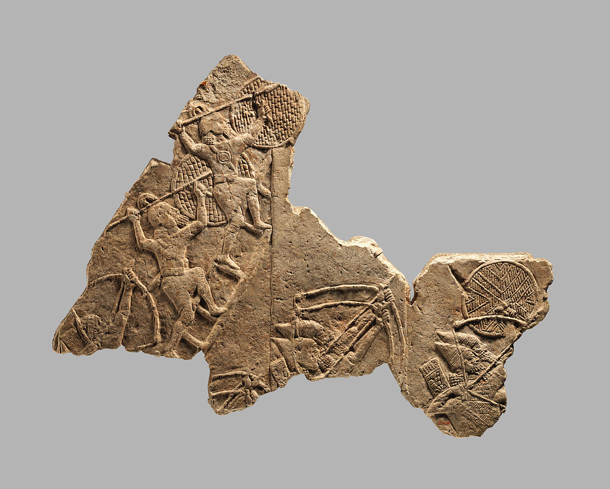 Relief fragment: siege of a city by Assyrian troops