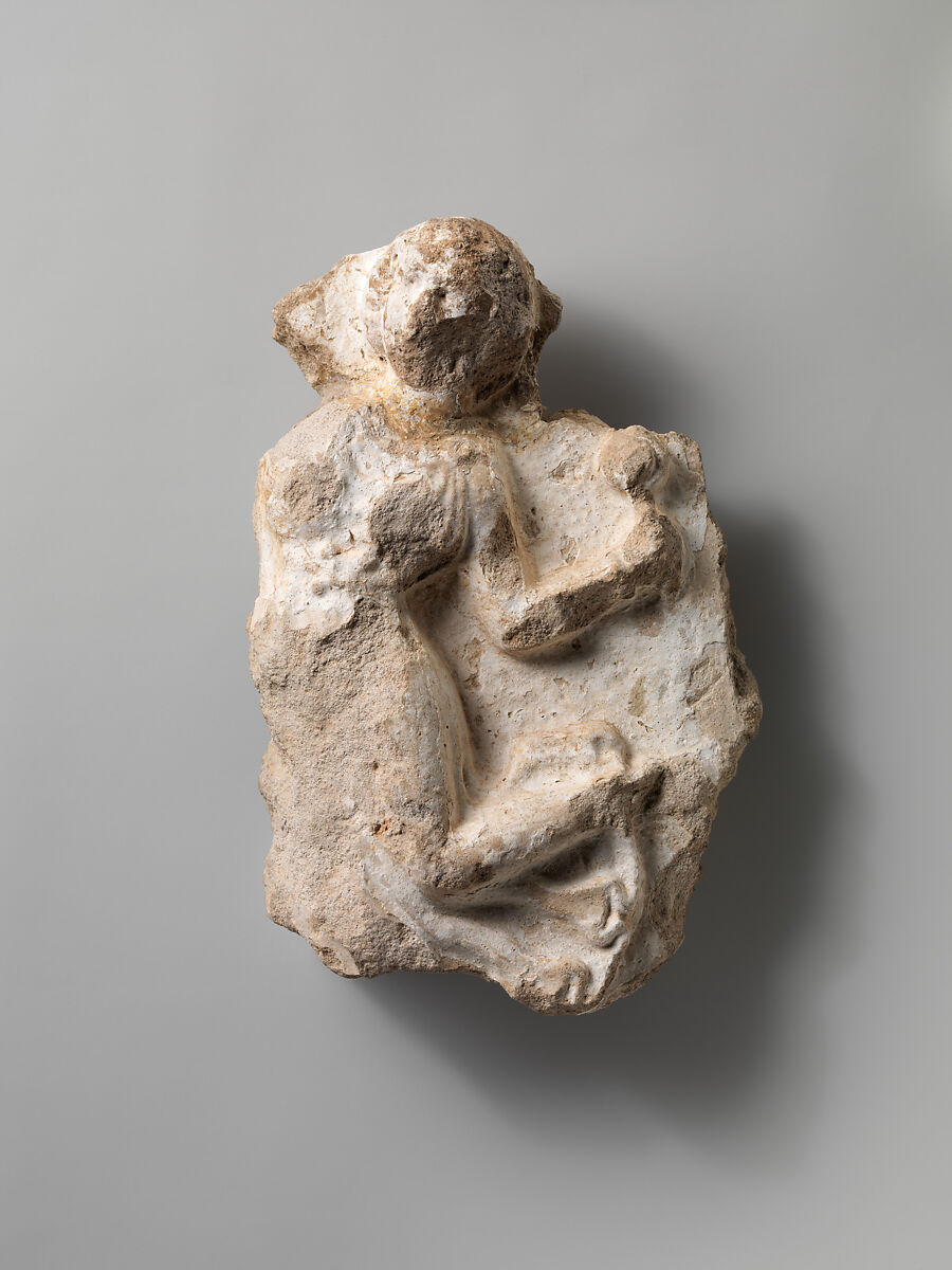 Fragment of a wall decoration with a female dancer