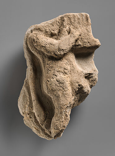 Fragment of a wall decoration with a figure playing a harp